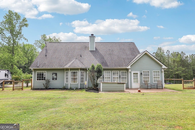 122 Eagle View Dr, Monticello, GA 31064 - rear view of property featuring a chimney, a patio, and roof with shingles
