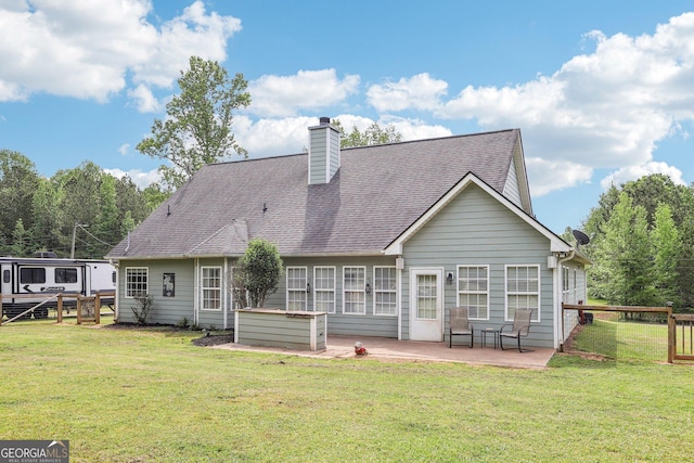122 Eagle View Dr, Monticello, GA 31064 - rear view of property featuring a patio area, roof with shingles, and a chimney