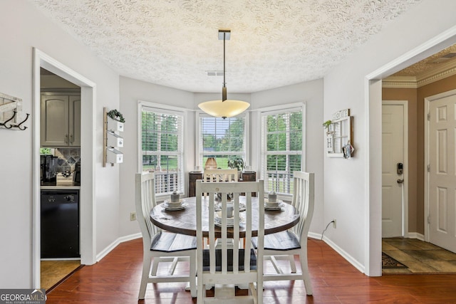 122 Eagle View Dr, Monticello, GA 31064 - dining room with healthy amount of natural light, dark wood-type flooring, baseboards, and a textured ceiling