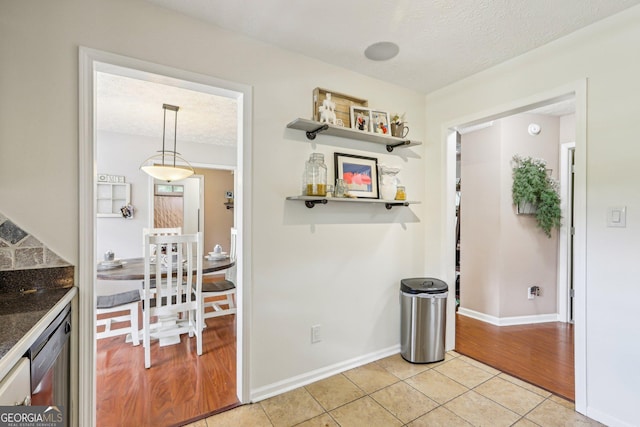 122 Eagle View Dr, Monticello, GA 31064 - unfurnished dining area featuring light tile patterned floors, baseboards, and a textured ceiling