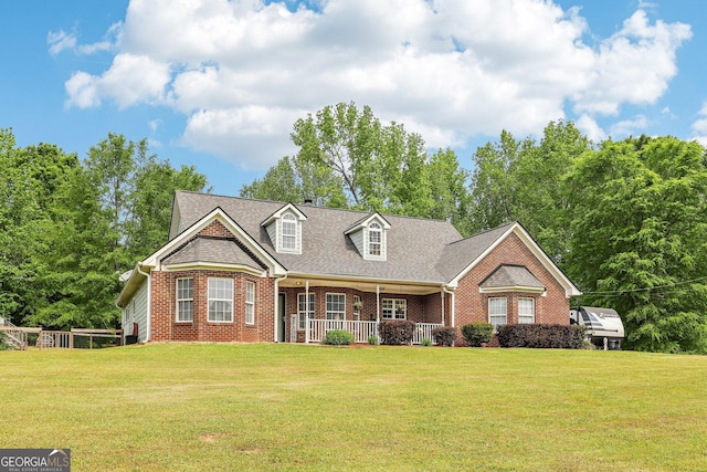 122 Eagle View Dr, Monticello, GA 31064 - cape cod-style house featuring brick siding, a porch, and a front yard