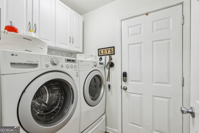 122 Eagle View Dr, Monticello, GA 31064 - laundry area featuring separate washer and dryer and cabinet space