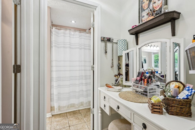 122 Eagle View Dr, Monticello, GA 31064 - bathroom featuring tile patterned floors, vanity, a shower with shower curtain, and a textured ceiling