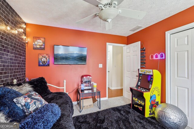 122 Eagle View Dr, Monticello, GA 31064 - living area with carpet floors, a textured ceiling, ceiling fan, and baseboards