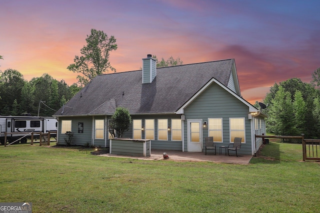 122 Eagle View Dr, Monticello, GA 31064 - rear view of property with a yard, a chimney, a patio area, and a shingled roof