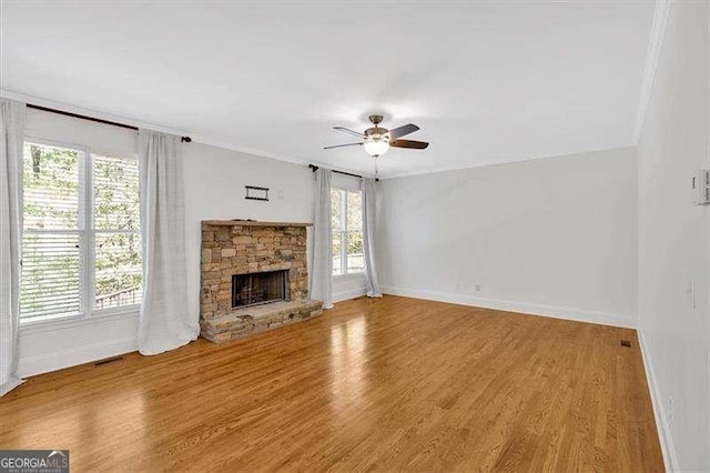 kitchen with a kitchen bar, light wood-type flooring, crown molding, a chandelier, and stainless steel fridge
