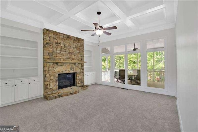 unfurnished room featuring carpet and baseboards