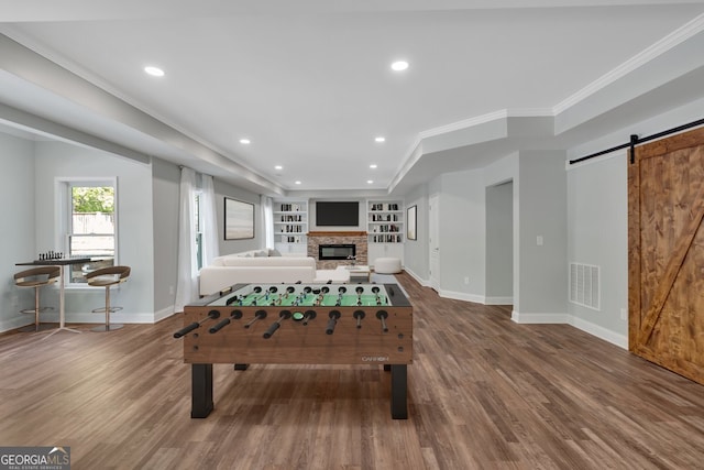 unfurnished living room with wood finished floors, visible vents, and french doors