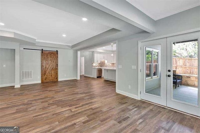 kitchen featuring dark wood-type flooring, white cabinets, and baseboards