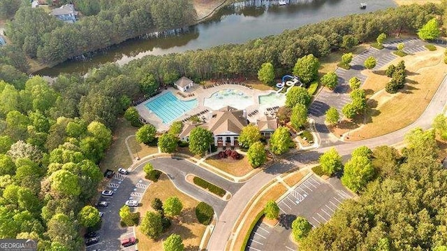 birds eye view of property with a water view