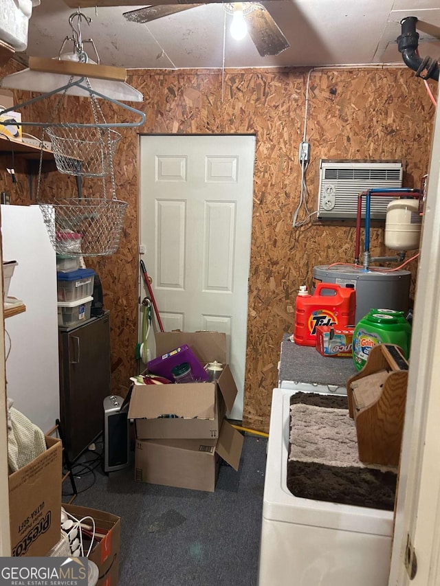 interior space with ceiling fan, an AC wall unit, and washer / dryer