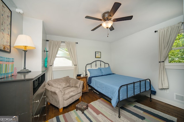 1907 Shalimar Dr NE, Atlanta, GA 30345 - bedroom with wood finished floors, multiple windows, and a ceiling fan
