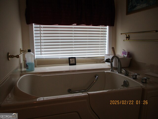 bathroom featuring a washtub