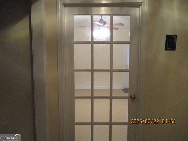 interior details with a ceiling fan