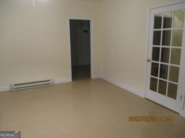 empty room with baseboards and baseboard heating