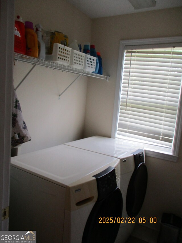 laundry room featuring washing machine and dryer and laundry area
