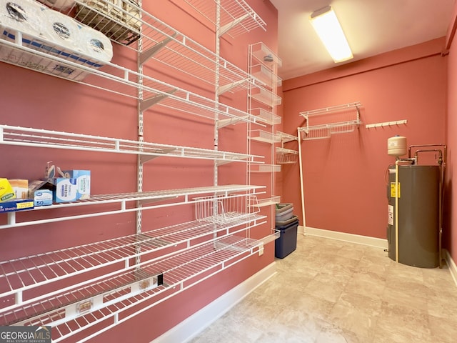 walk in closet featuring water heater