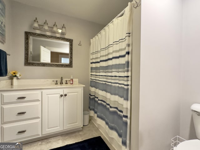 full bathroom with toilet, a shower with curtain, tile patterned flooring, and vanity