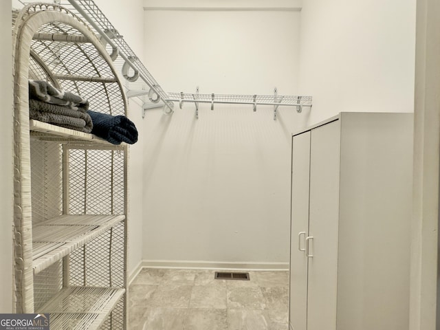 walk in closet featuring visible vents