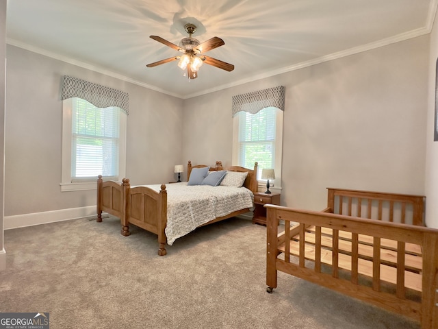 bedroom featuring crown molding, carpet flooring, and multiple windows