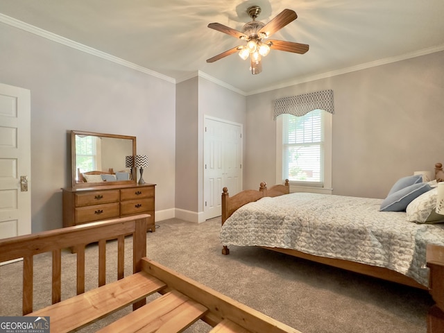 bedroom featuring crown molding, carpet flooring, baseboards, and ceiling fan