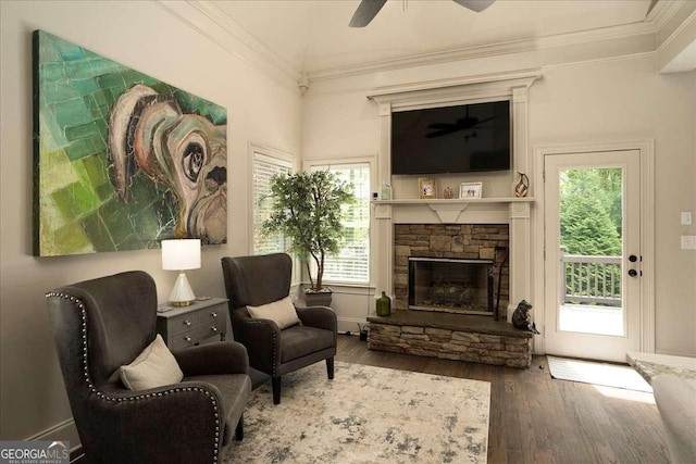 175 Tillman Ln, Athens, GA 30606 - living area featuring wood finished floors, a ceiling fan, crown molding, a fireplace, and healthy amount of natural light