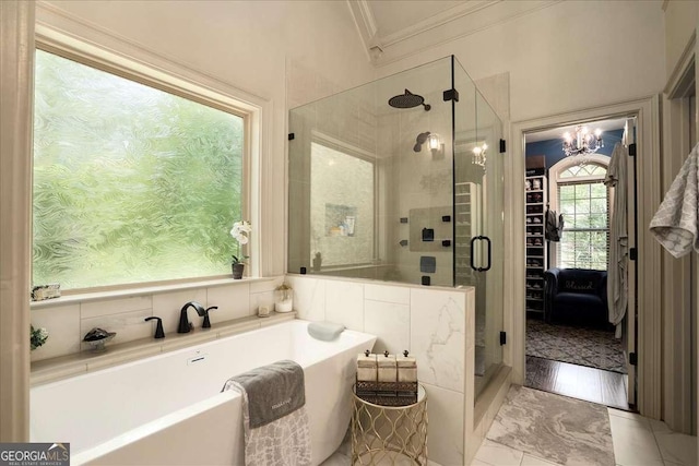 175 Tillman Ln, Athens, GA 30606 - bathroom with ornamental molding, a freestanding tub, a shower stall, and a chandelier