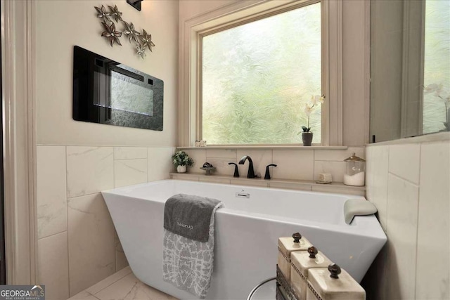 175 Tillman Ln, Athens, GA 30606 - full bath featuring tile walls, a freestanding bath, and healthy amount of natural light