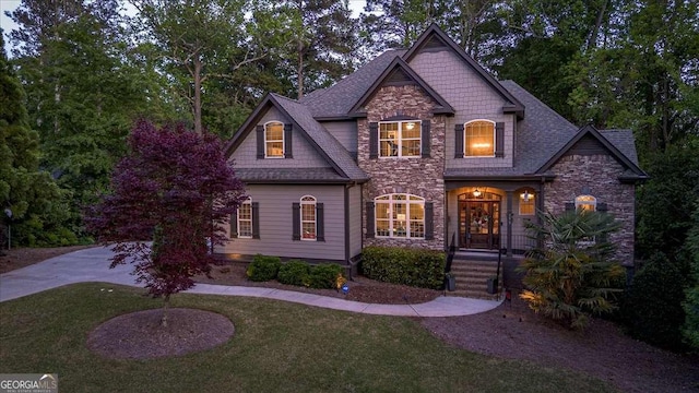 175 Tillman Ln, Athens, GA 30606 - craftsman-style house with stone siding, a front yard, and a shingled roof