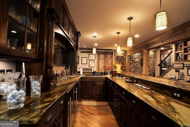 175 Tillman Ln, Athens, GA 30606 - indoor wet bar featuring dark wood finished floors, pendant lighting, and stairs