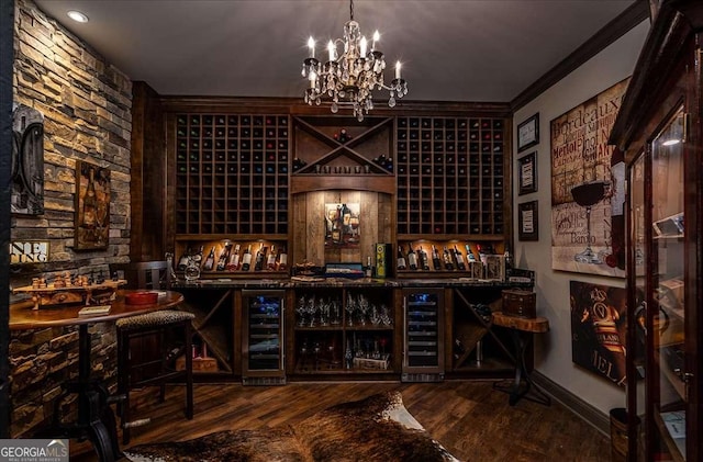 175 Tillman Ln, Athens, GA 30606 - wine area with beverage cooler, wood finished floors, a chandelier, crown molding, and baseboards