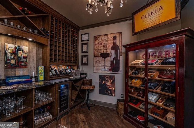 175 Tillman Ln, Athens, GA 30606 - wine cellar featuring beverage cooler, ornamental molding, a dry bar, baseboards, and dark wood finished floors