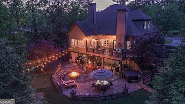 175 Tillman Ln, Athens, GA 30606 - back of house featuring a fire pit, a jacuzzi, a patio area, a chimney, and a deck