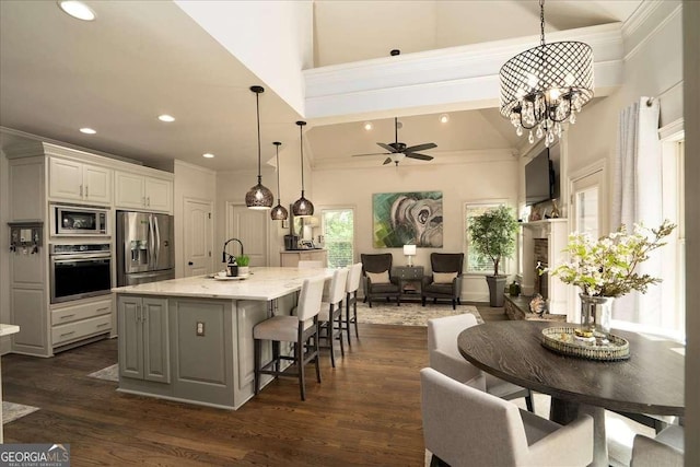 175 Tillman Ln, Athens, GA 30606 - kitchen featuring appliances with stainless steel finishes, open floor plan, crown molding, a ceiling fan, and recessed lighting