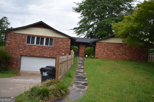 2461 Mcalpin Ter, East Point, GA 30344 - single story home with a garage, brick siding, and concrete driveway