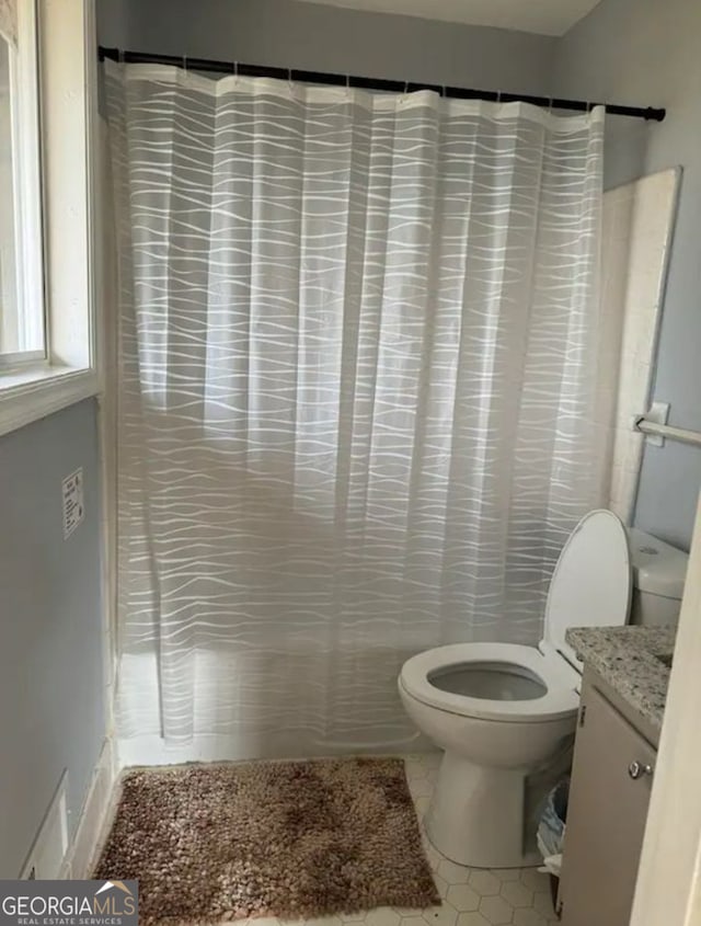 2461 Mcalpin Ter, East Point, GA 30344 - full bath with vanity, a shower with shower curtain, and tile patterned floors