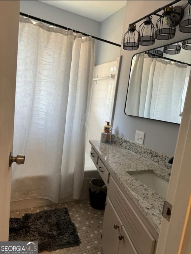2461 Mcalpin Ter, East Point, GA 30344 - full bath featuring vanity, shower / tub combo, and tile patterned floors