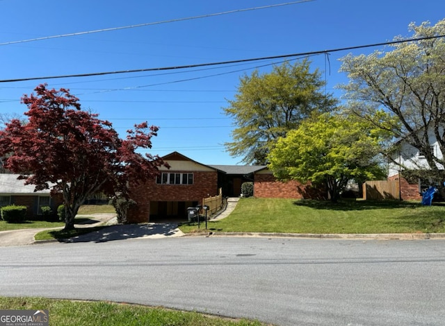 2461 Mcalpin Ter, East Point, GA 30344 - view of front of home featuring a front lawn and brick siding