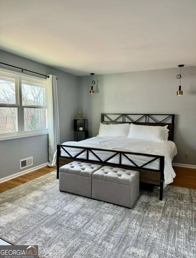 2461 Mcalpin Ter, East Point, GA 30344 - bedroom with baseboards and wood finished floors