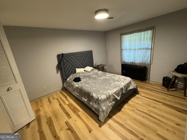 2461 Mcalpin Ter, East Point, GA 30344 - bedroom with light wood-type flooring and baseboards