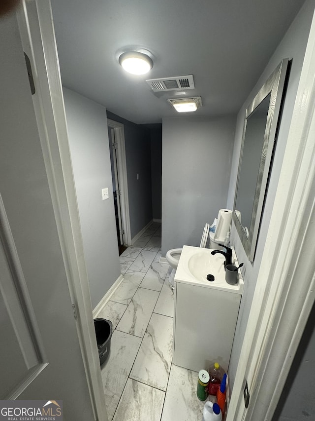 2461 Mcalpin Ter, East Point, GA 30344 - bathroom with marble finish floors and vanity