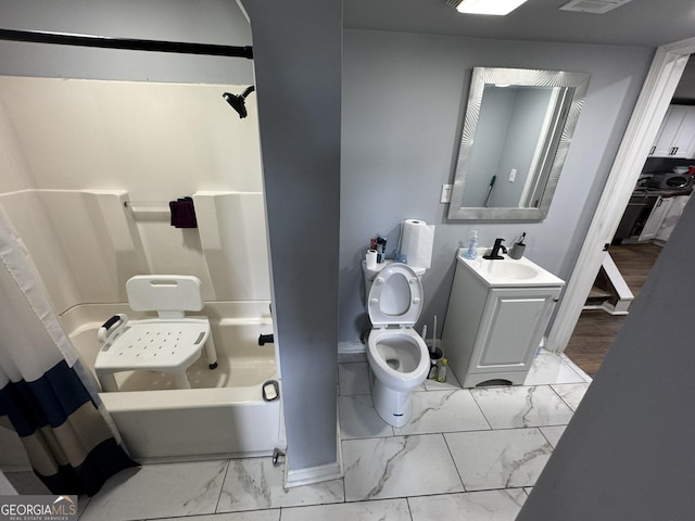 2461 Mcalpin Ter, East Point, GA 30344 - full bathroom featuring marble look tiles, vanity, and shower / bath combination with curtain