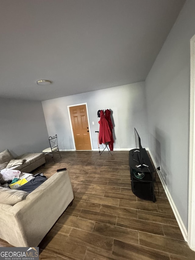 2461 Mcalpin Ter, East Point, GA 30344 - living area with dark wood-type flooring and baseboards