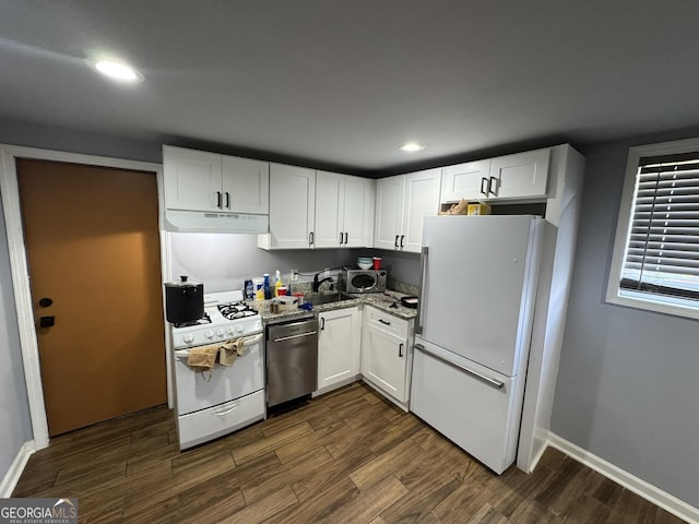 2461 Mcalpin Ter, East Point, GA 30344 - kitchen featuring stainless steel appliances, under cabinet range hood, dark wood-style floors, white cabinetry, and recessed lighting