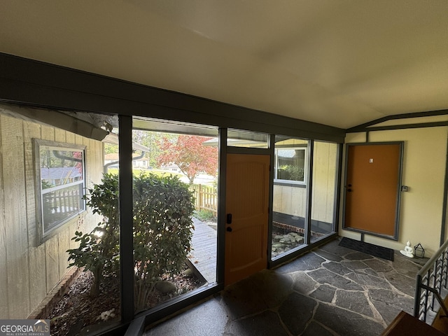 2461 Mcalpin Ter, East Point, GA 30344 - doorway to outside with lofted ceiling and stone floors