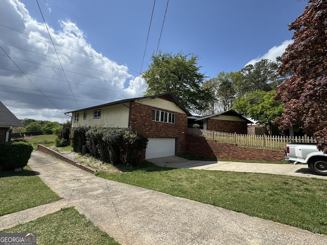 2461 Mcalpin Ter, East Point, GA 30344 - view of side of property with brick siding, driveway, and a garage