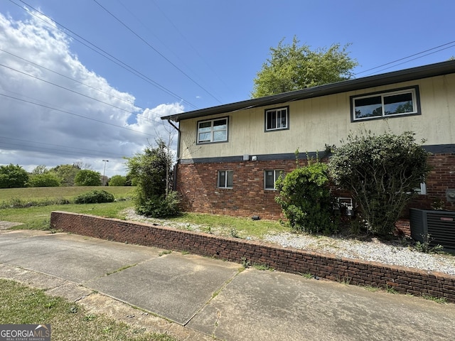 2461 Mcalpin Ter, East Point, GA 30344 - view of property exterior featuring brick siding and a patio