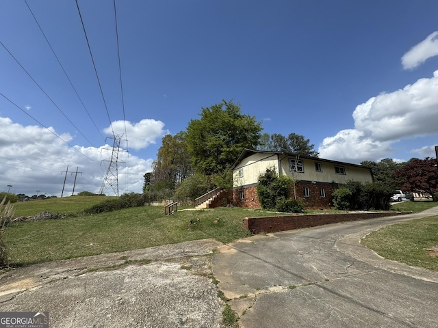 2461 Mcalpin Ter, East Point, GA 30344 - view of side of home featuring brick siding and a yard