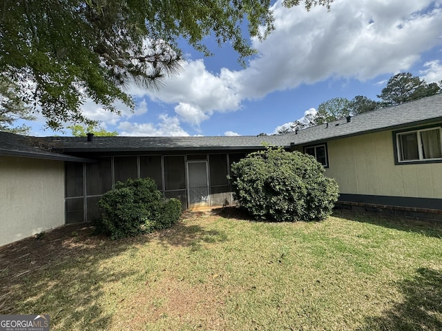 2461 Mcalpin Ter, East Point, GA 30344 - rear view of property featuring a sunroom and a lawn