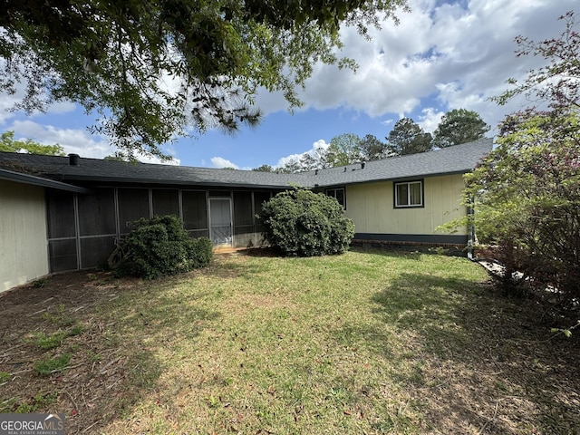 2461 Mcalpin Ter, East Point, GA 30344 - back of property featuring a sunroom and a yard